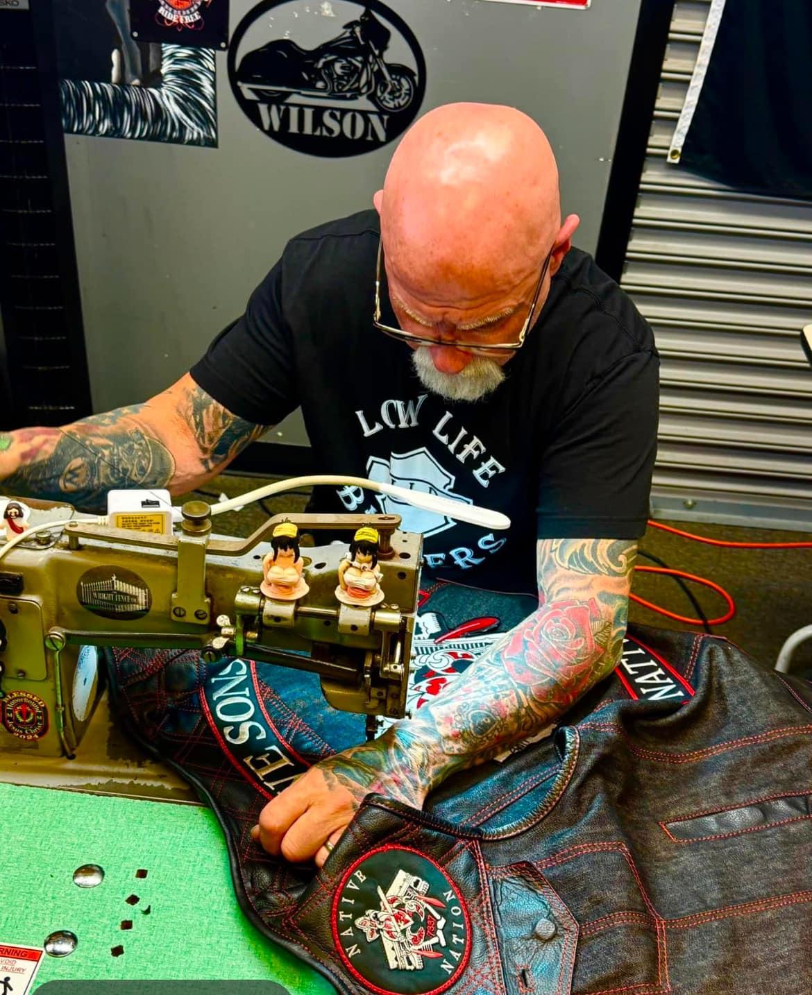 Riders waiting in the shop while patches are sewn