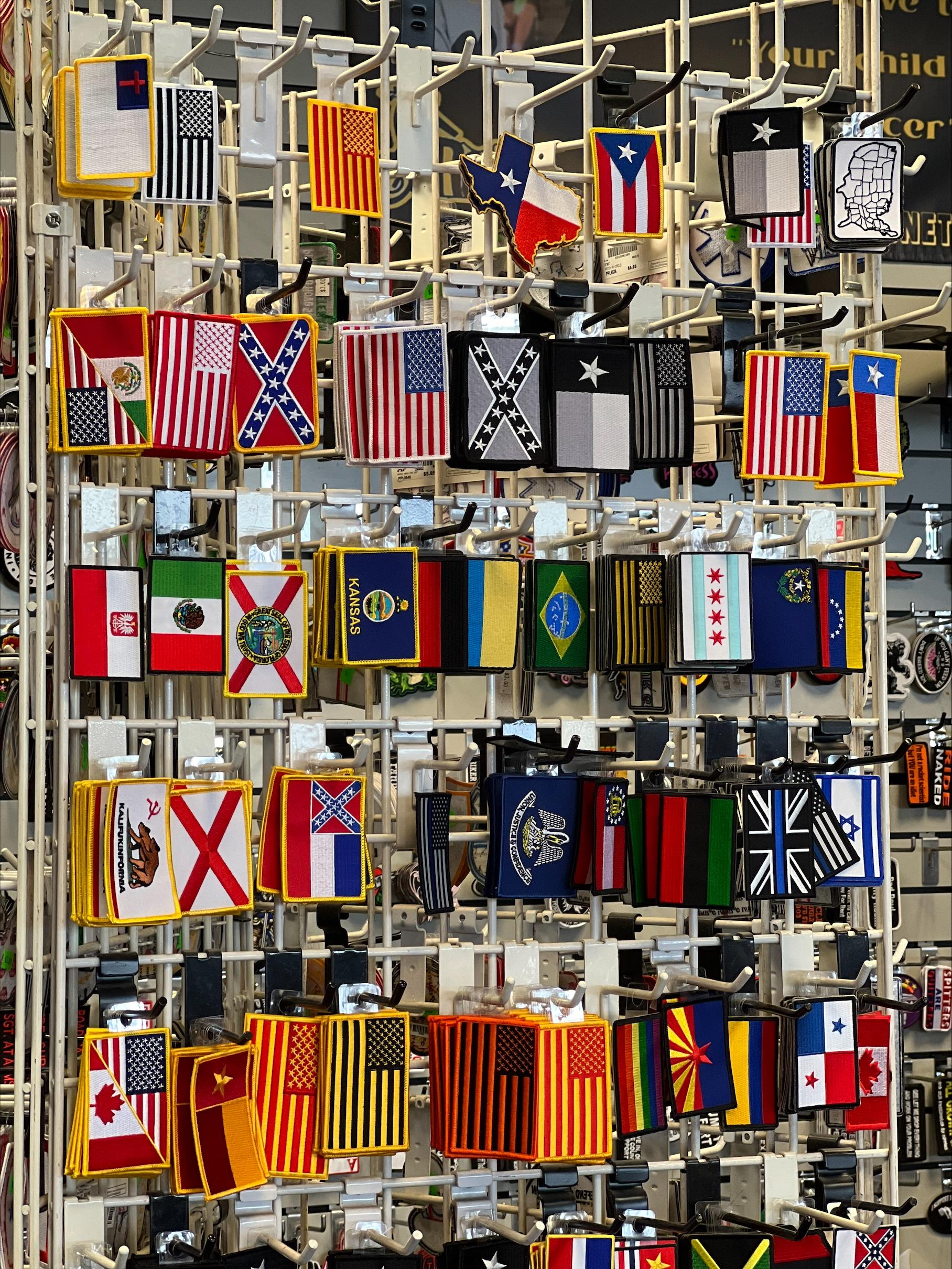 Close-up of custom biker patches on display